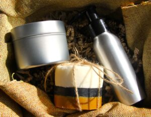 Plastic-free travel kit with solid shampoo, 2-in-1 mini soap, and dry oil in a reusable case